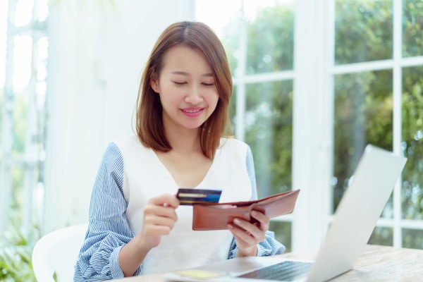 Women is buying with a credit card